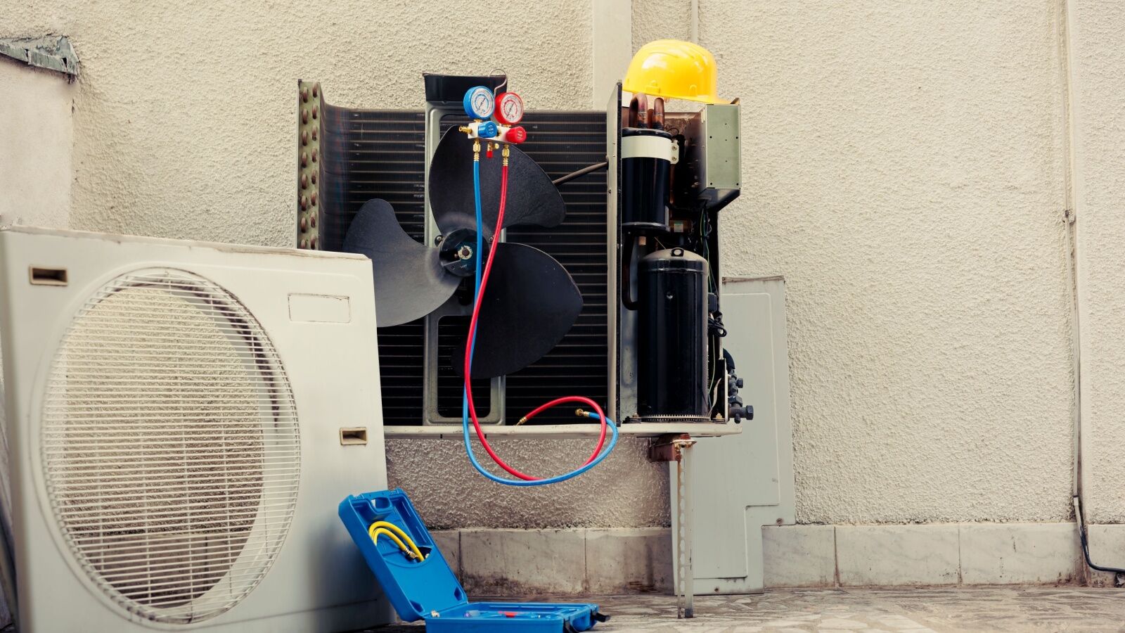Washburn_June25_Hero Outdoor AC unit getting an annual service.