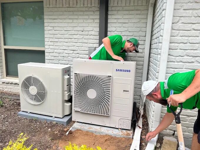 washburn-ac-company-technicians Washburn Air replacing outdoor AC units in Dallas-Fort Worth.