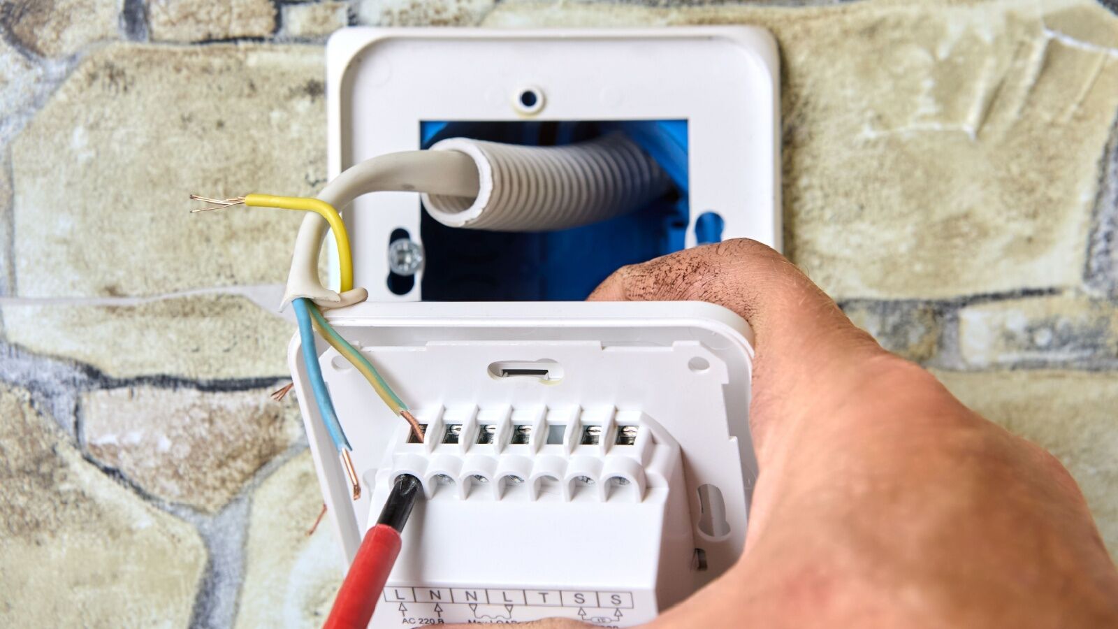 smart-thermostat-installation Smart thermostat being installed and calibrated in DFW.
