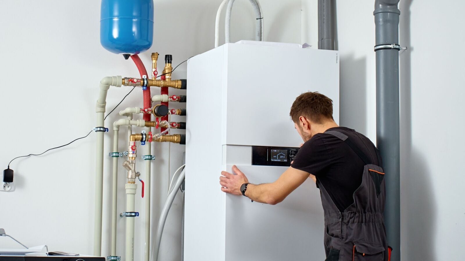 heating-system-maintenance-dfw-tx Washburn technician installing a new heating unit for a local business.