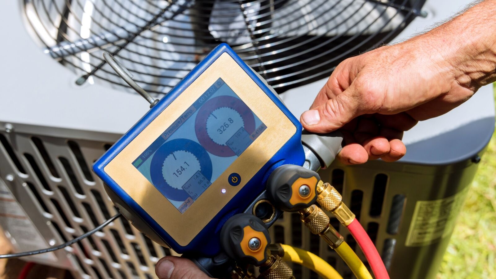 hvac-maintenance-dallas-fort-worth A manifold gauge being used to balance refrigerant levels.